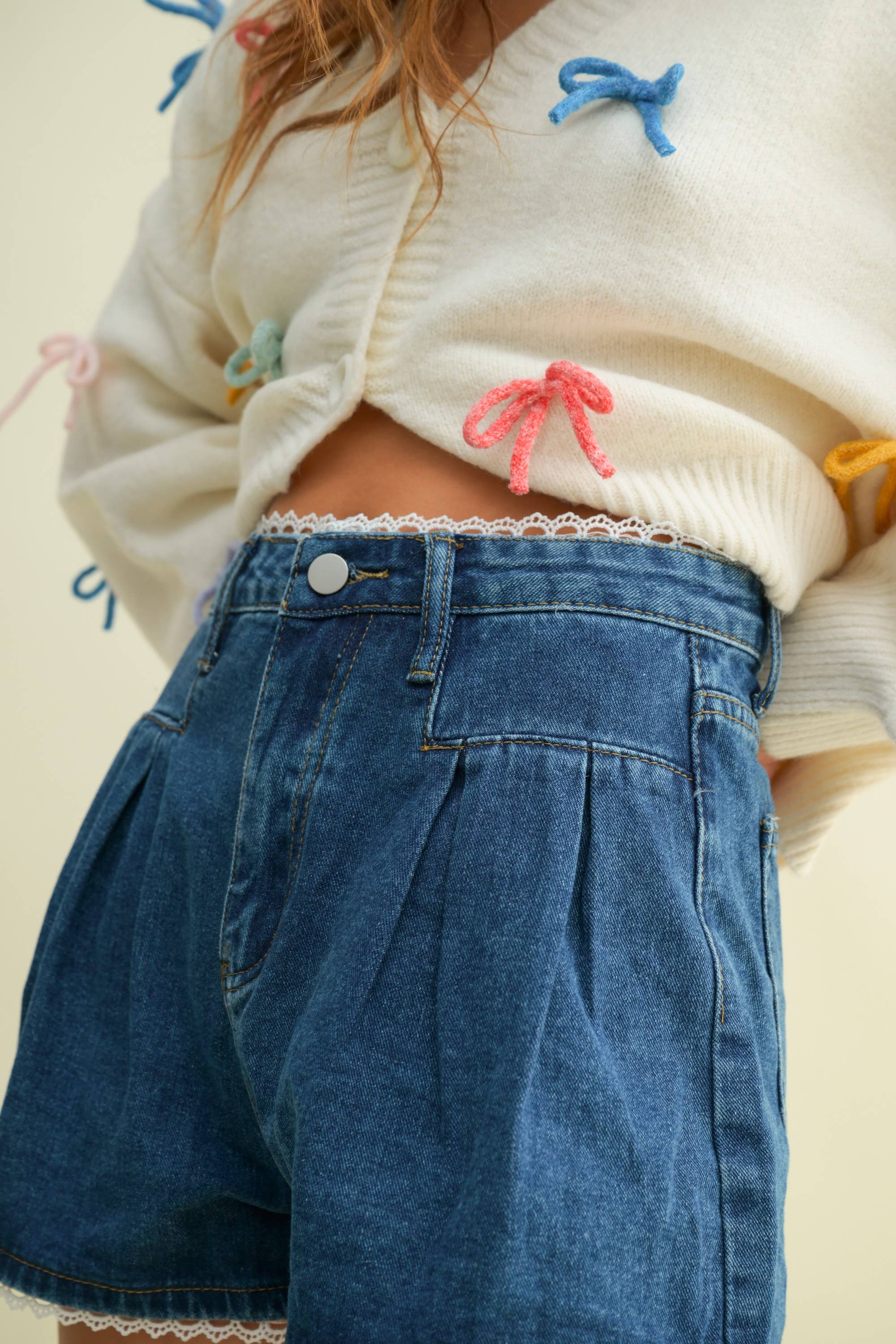 CP13470A - LACE TRIM PLEATED DENIM SHORTS